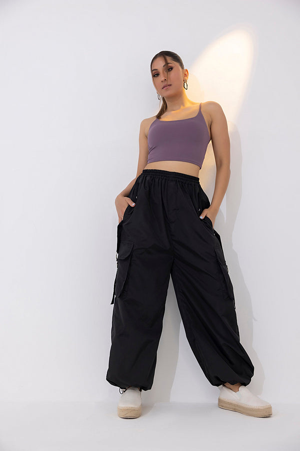 Women's black parachute cargo pants.