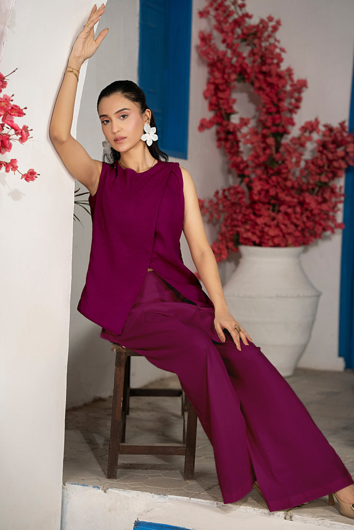 Model posing in Auberglen dark purple co-ord set showcasing movement and modern minimal design